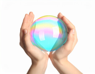 Two hands gently cradle a large, spherical bubble shimmering with vibrant rainbow colors against a clean white background, symbolizing fragility, innovation, and potential.