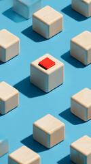 Geometric arrangement of light wood cubes with a single red square accent on a bright blue background