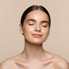 Beautiful woman with glowing skin and closed eyes on beige background skincare routine