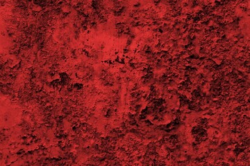 Red background, Rough textured red wall with visible cracks and dark abstract patterns, ideal for backgrounds and art projects.