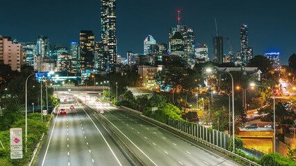 4K Time lapse Footage of Brisbane cityscape with expressway traffic road at the evening time after working hour, Queensland, Australia, business finance and industry and Transportation concept
 - Powered by Adobe