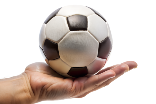 A persons hand holding a classic black and white soccer ball, isolated on a transparent background