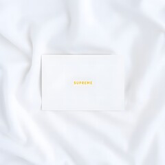 Paper Note with Supreme Brand Logo on White Fabric Background