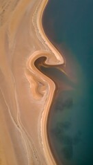 Aerial View of Sand Dunes and Turquoise Water