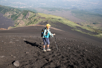 hiker trekking on mount Etna