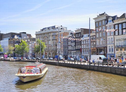 Rokin canal during a summer season in the city center of Amsterdam, Netherlands