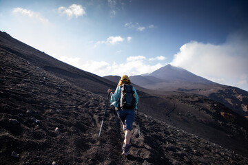 hiker trekking on mount Etna