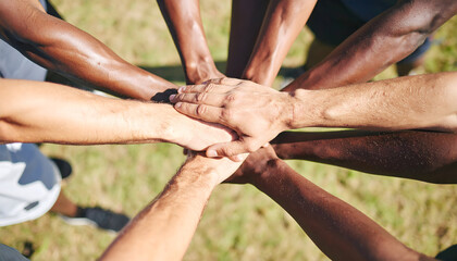 Diverse hands, united in a group, symbolize friendship, love, and teamwork