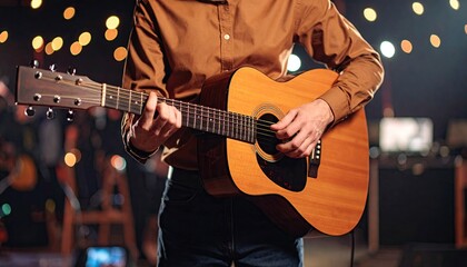 Obraz premium Person playing acoustic guitar in a performance setting