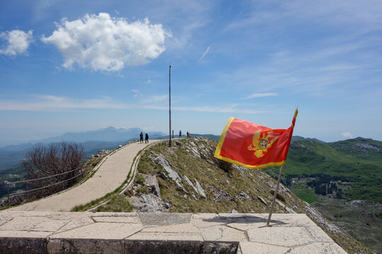 Montenegrin flag hoisted on top of Mount Lovcen at entrance of Mausoleum of Njegos. Cetinje, Montenegro