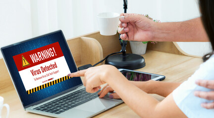 Virus warning alert on computer screen detected modish cyber threat , hacker, computer virus and...