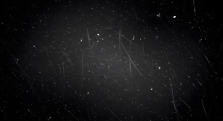 Distressed film grain overlay adds texture to dark background for creative projects