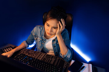 Stressful young beautiful asian creative looking on pc to search project creator social media...