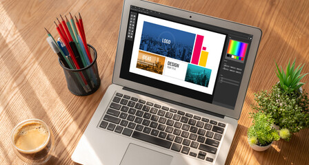 Graphic designer software for modern design of web page and commercial ads showing on the computer...