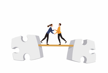Two people shaking hands while balancing on puzzle pieces  