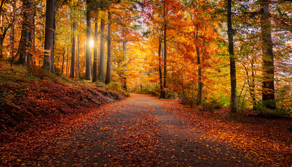 Obraz premium vibrant autumn forest pathway with colorful falling leaves