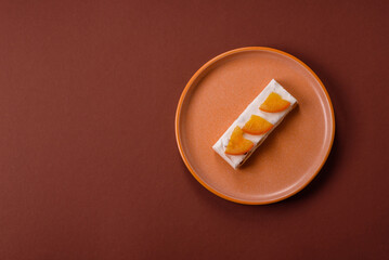 Nougat or white caramel with hazelnuts and pistachios and citrus pieces. White nougat with nuts