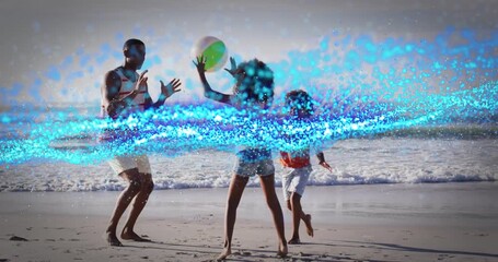 Girl raising beach ball overhead initiating family catching game on wet sand near waves - Powered by Adobe