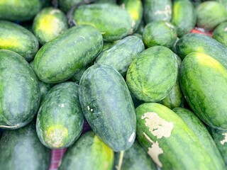Watermelon with red-flesh varieties close up background. Stock photo.