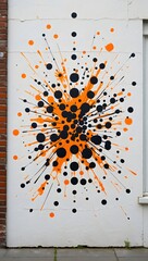 Abstract splatter paint art on wall black and orange color explosion design decor