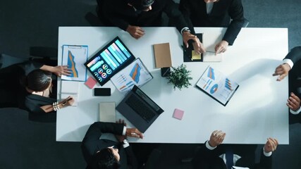 Top down aerial view of smart businessman use vr headset to enter virtual world at meeting while diverse business people send financial information and data analysis graph in database. Directorate. - Powered by Adobe