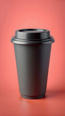 Matte black coffee cup with lid on coral background