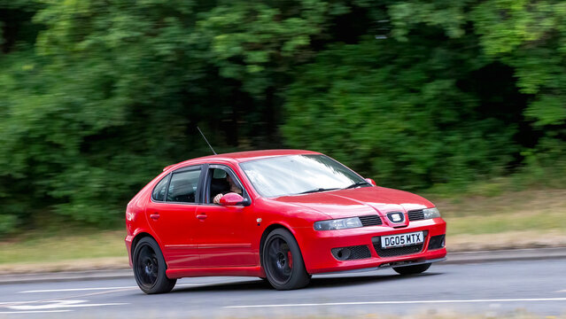 Milton Keynes,Bucks,UK - July 17th 2025: 2005 red Seat Leon car driving on a British road