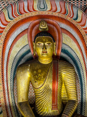 Fototapeta premium Interior of the second Cave of the Great Kings (Maharaja Viharaya), seated Buddha, Dambulla Cave temple, Sri lanka