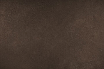 Abstract grungy texture background with different shades of dark matte brown color. Painted canvas, concrete surface, studio backdrop, grainy textured effect