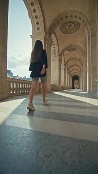 Walking tourist near the Louvre in Paris France enjoying travel sightseeing art galleries and historic architecture of the capital city in the heart of Europe