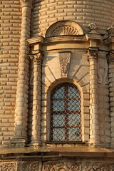 Beautiful entrance with windows, door in baroque medieval style old church building on nature...
