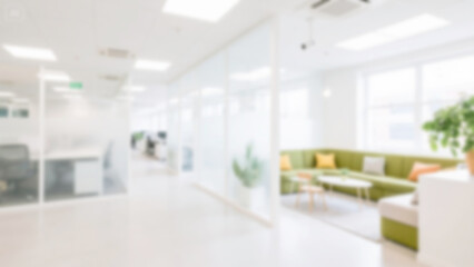 Blurred bright shared office with industrial ceiling, white brick walls, and light hardwood floors. Soft focus wide-angle view perfect for modern, collaborative virtual backgrounds.

