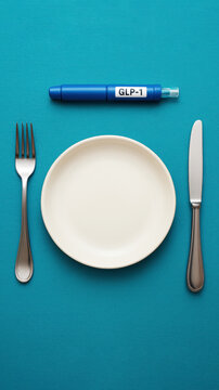 GLP-1 injection with empty plate and cutlery, concept of weight loss medication and appetite control, semaglutide treatment for obesity, medical approach to dieting and hunger regulation