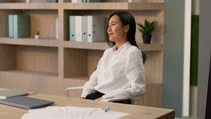 Relaxed carefree happy Asian Korean business woman female leader Japanese Chinese businesswoman...