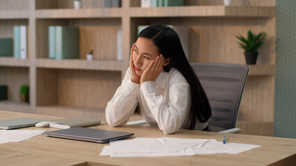 Tired upset Asian Japanese office worker employer business woman Chinese Korean female...