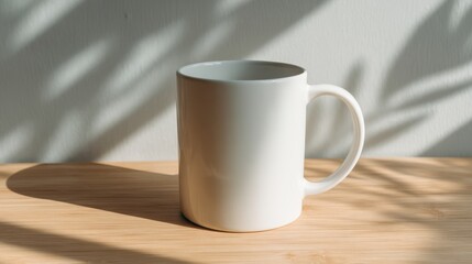 Crisp and minimalistic design of a blank white ceramic mug resting elegantly on a light wood table, inviting warm sunlight and soft shadows to play around it