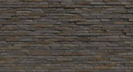 Obraz premium Stacked stone wall with varying shades of gray and brown