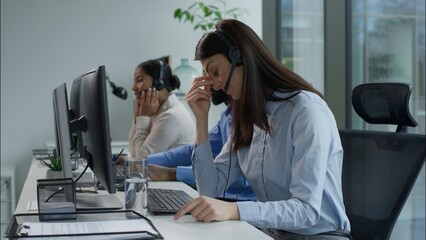 Tired exhausted Caucasian business woman callcenter worker headset touch head suffer headache pain...