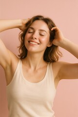 Fototapeta premium Joyful young caucasian female relaxing against pink background