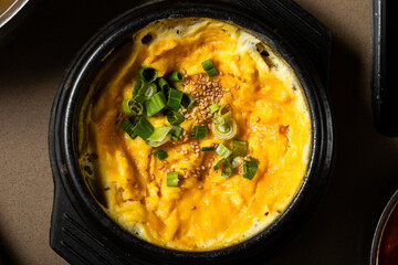 Cooked scrambeled eggs with green onions 