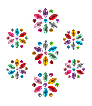Decorative crystal rhinestone flowers. Isolated multicolored сrystal decals in the shape of flowers, decorative stickers for manicure, handcrafting or patchwork.