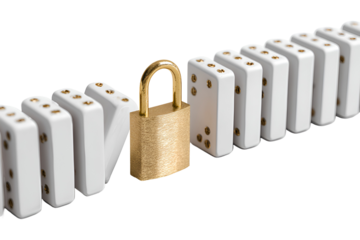 Gold padlock stopping falling dominoes security concept