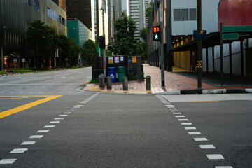 The image shows an empty street and crosswalk in an urban area