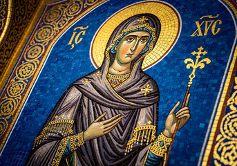 Fototapeta premium A detailed mosaic of a religious figure, featuring intricate patterns and vibrant colors. The figure is adorned in traditional robes, with a serene expression.