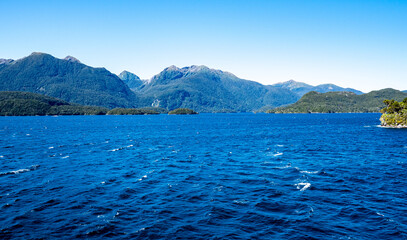 bright blue water scenery views from cruise ship idyllic milford sound fiordland national park new...