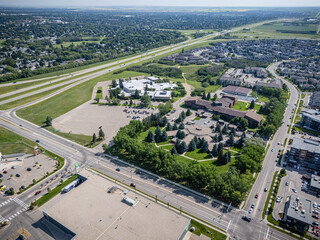 Obraz premium City view from above with a large parking lot and a few buildings