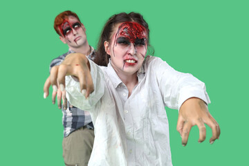 Scary zombies on green background