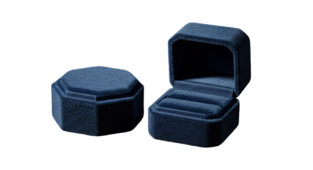 Two navy blue velvet octagonal ring boxes, one open, showcasing a delicate interior.