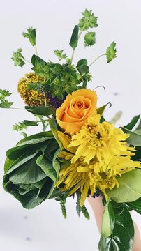 ellow flower bouquet, beautiful floral arrangement, cheerful flower display, vibrant floral colors, charming woman pose, lovely flower composition, fresh bouquet details, serene outdoor moment, elegan