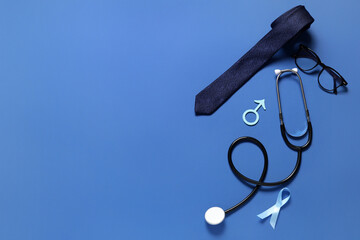 Male sign with stethoscope, ribbon and tie on blue background. Prostate cancer awareness concept